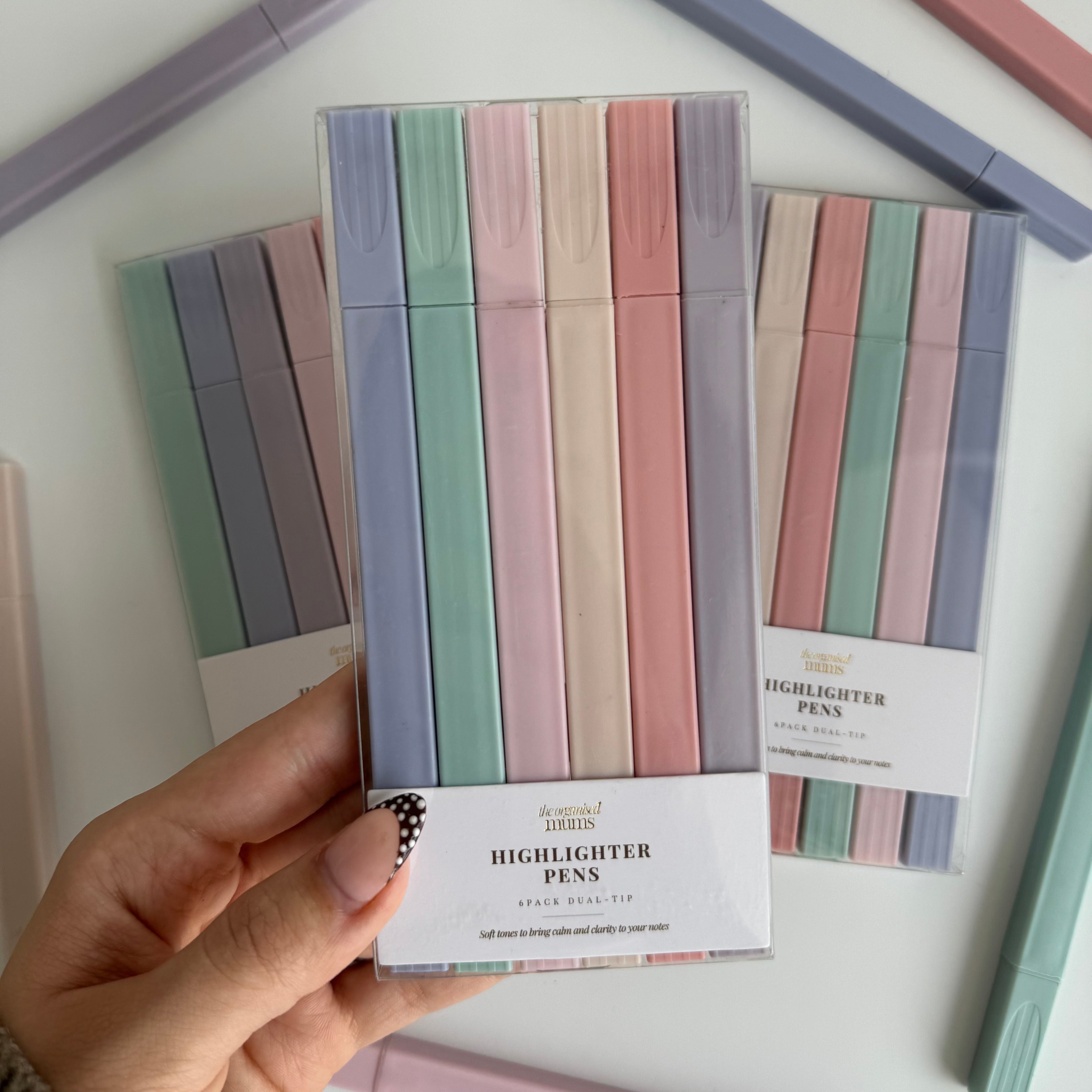 Set of pastel-colored highlighter pens with packaging on a white background