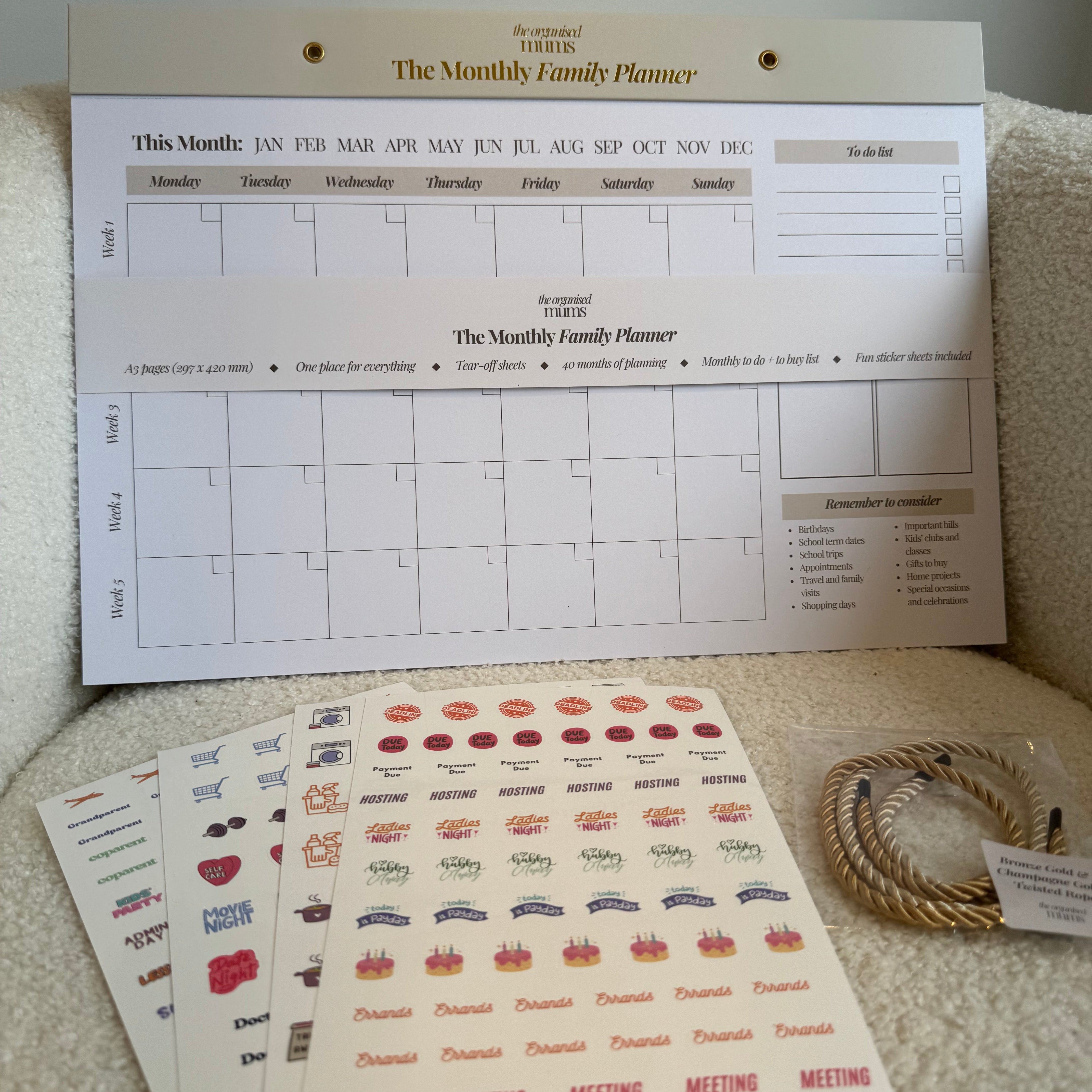 Family planner and decorative stickers on a textured surface